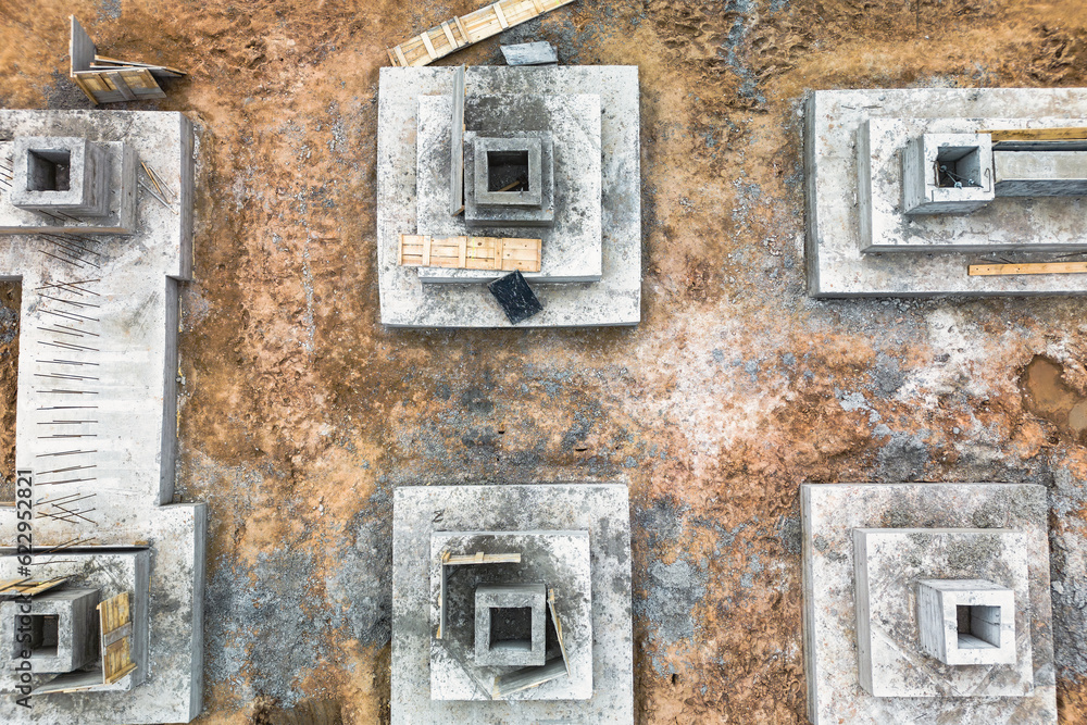 Monolithic reinforced concrete foundations for the construction of a large building. Rostverk at the construction site. Construction pit with foundation. close-up. View from above.