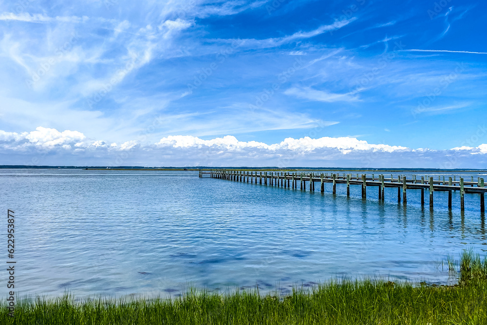 Pier extending into water on Chincoteague Island in Virginia.