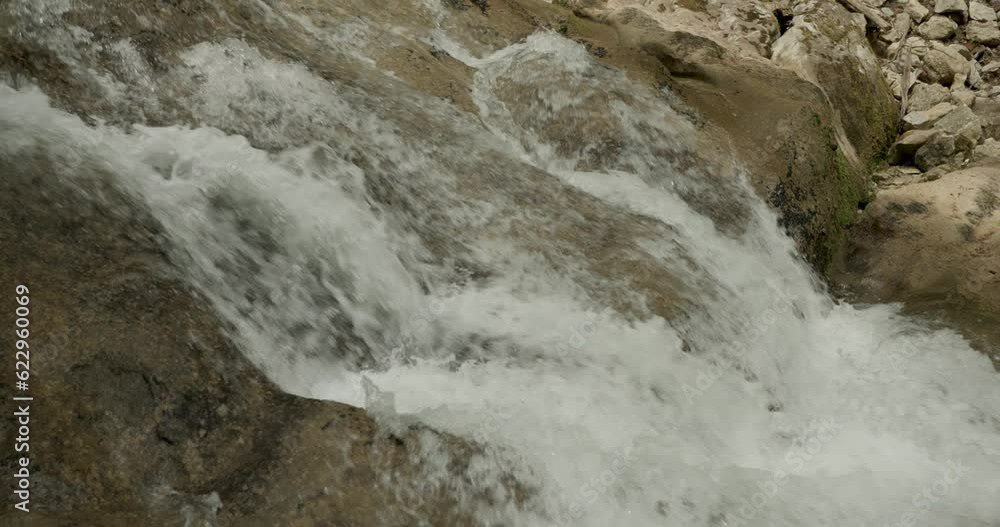 Closeup of a gurgling stream in slow motion. Concept ecology. Closeup of a gurgling stream in slow motion. Concept ecology.