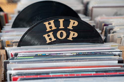 Hip hop vinyls seen stacked on rack photo