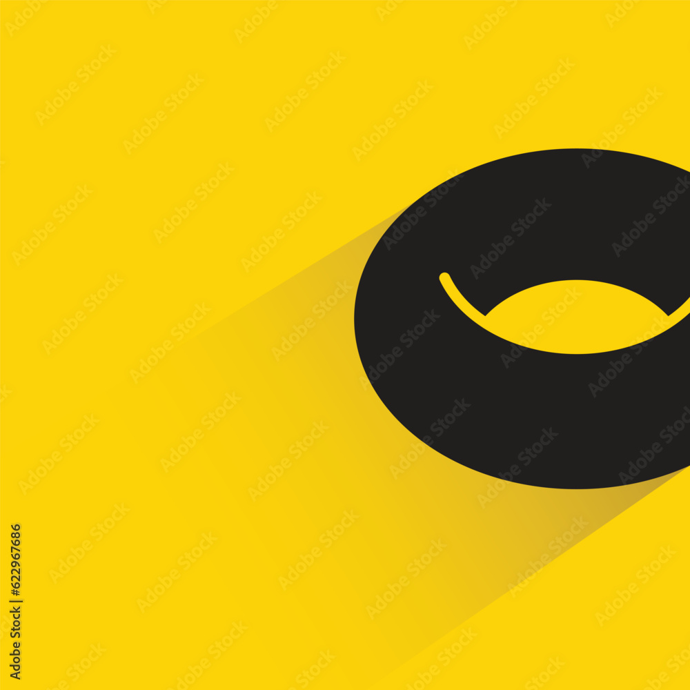Obraz premium donut with shadow on yellow background