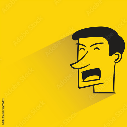 male face with shadow on yellow background