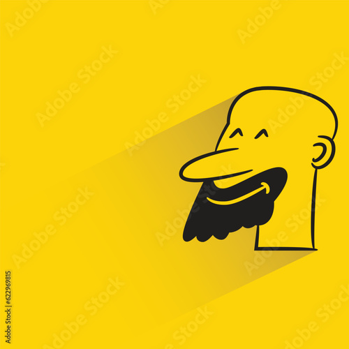 bald man with shadow on yellow background