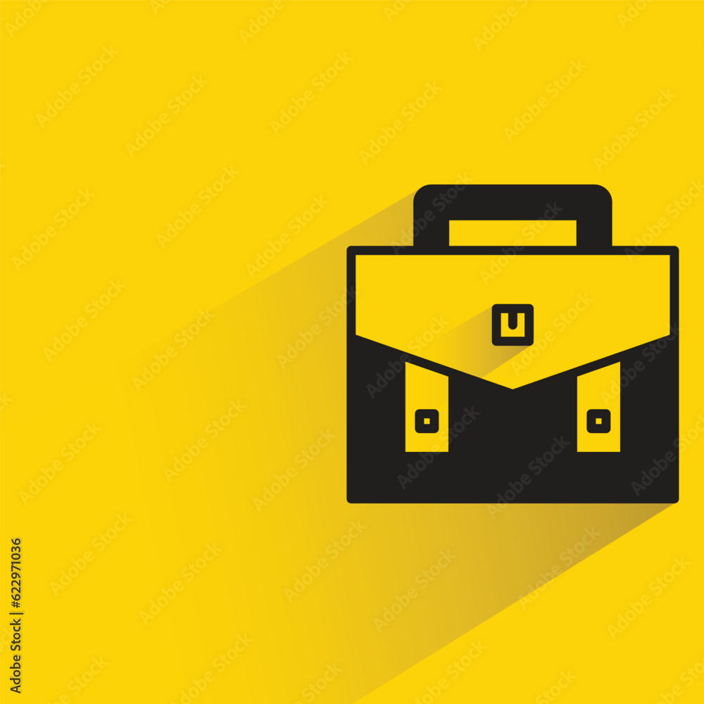 briefcase with shadow on yellow background briefcase with shadow on yellow background
