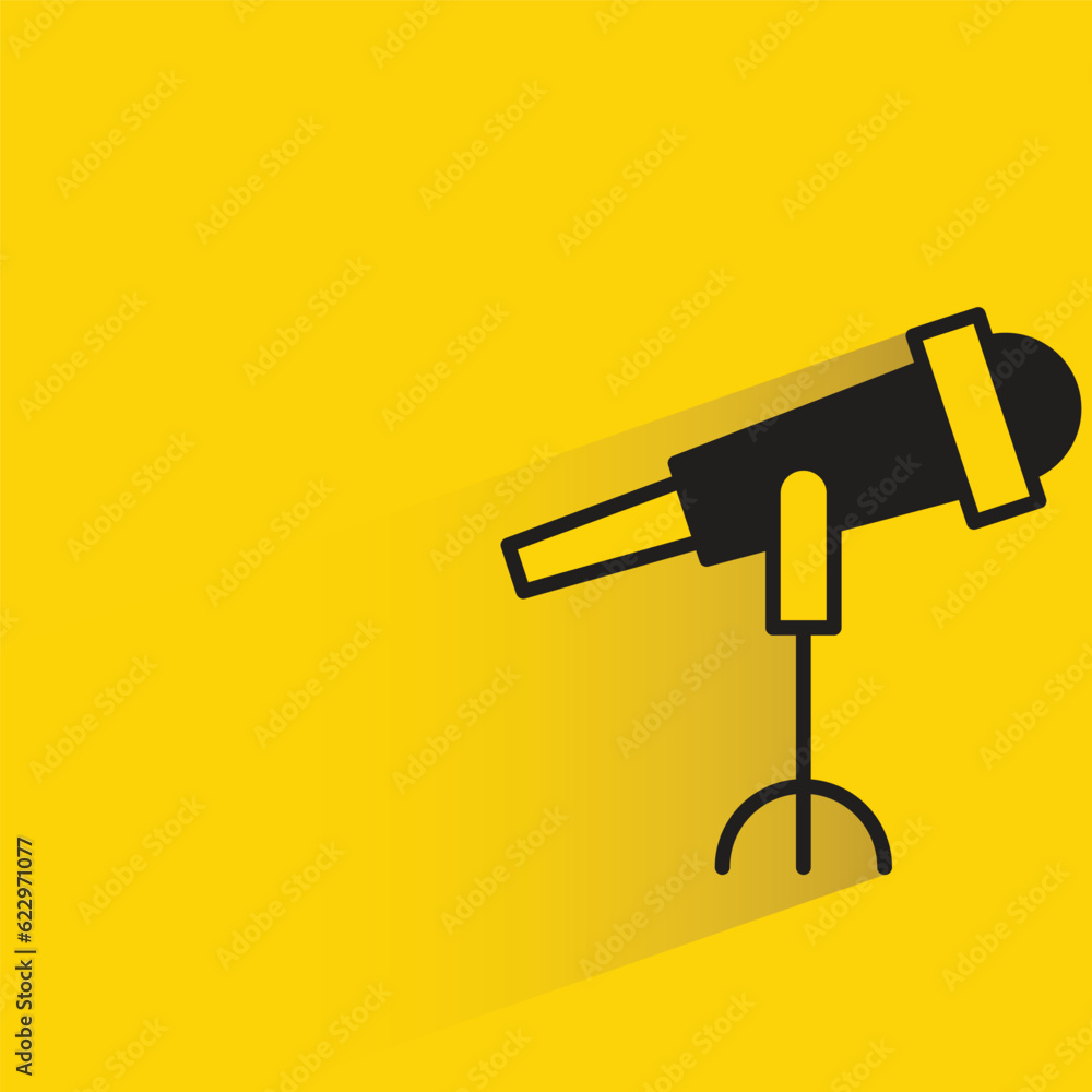 telescope with shadow on yellow background telescope with shadow on yellow background