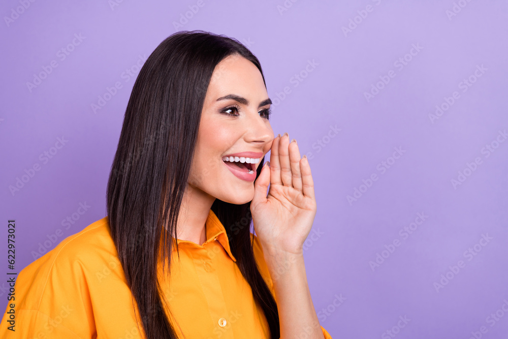 Portrait of pleasant woman wear oversize shirt hand on cheek scream into empty space announce sale isolated on violet color background