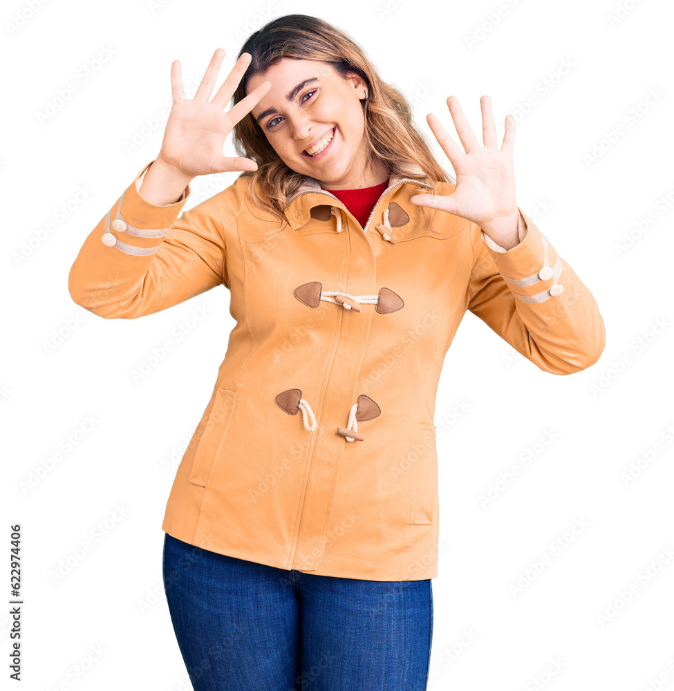 Young caucasian woman wearing casual clothes showing and pointing up with fingers number ten while smiling confident and happy. Young caucasian woman wearing casual clothes showing and pointing up with fingers number ten while smiling confident and happy.