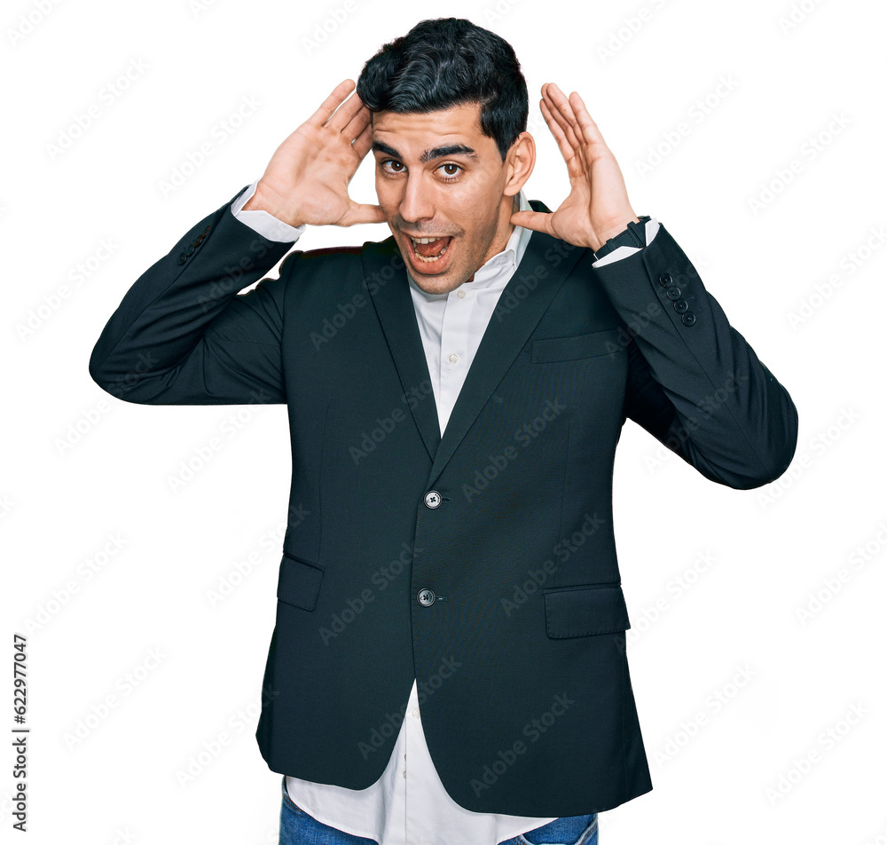 Handsome hispanic man wearing business clothes smiling cheerful playing peek a boo with hands showing face. surprised and exited Handsome hispanic man wearing business clothes smiling cheerful playing peek a boo with hands showing face. surprised and exited