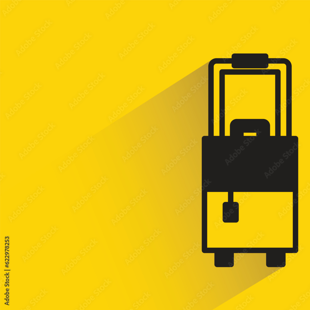 luggage bag with shadow on yellow background luggage bag with shadow on yellow background