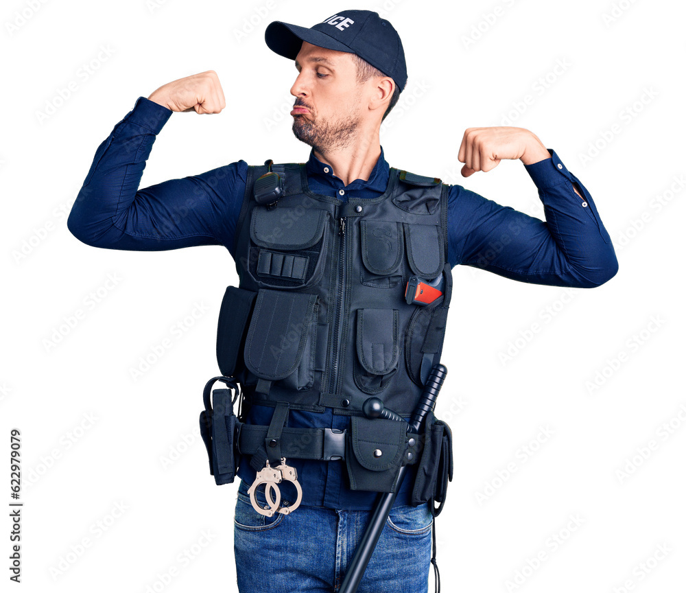 Young handsome man wearing police uniform showing arms muscles smiling proud. fitness concept. Young handsome man wearing police uniform showing arms muscles smiling proud. fitness concept.