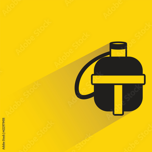 water canteen with shadow on yellow background