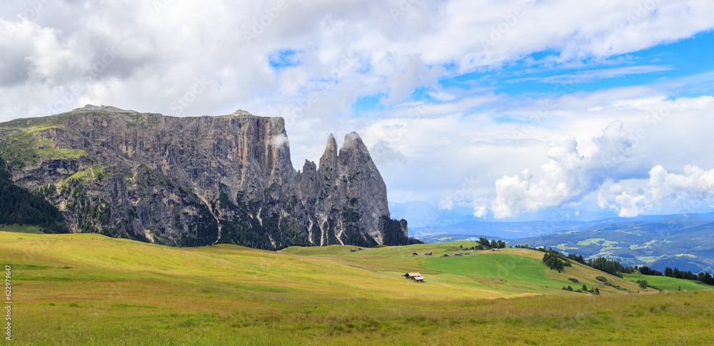 Panoramic view at the cliffs and valley of Alpe di Suisi mountains in South Tyrol, Italy.