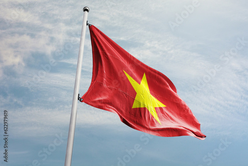 The flag of Vietnam features a yellow five-pointed star on a red background. The flag is a symbol of the country's struggle against domination by the French and communist leadership
