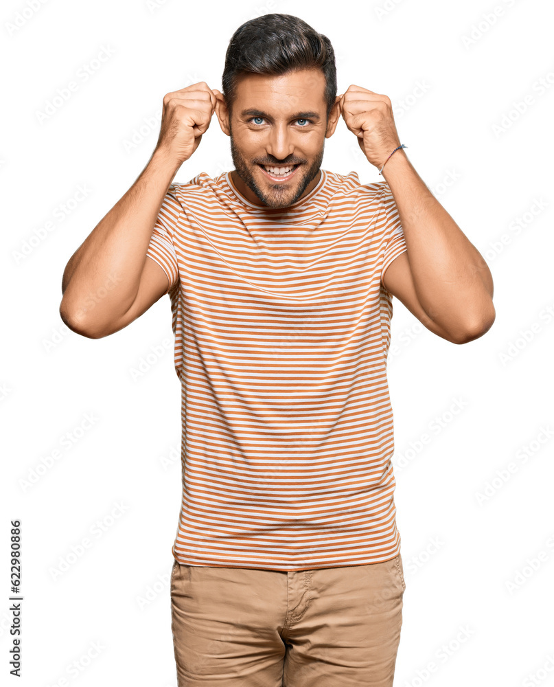 Handsome hispanic man wearing casual clothes smiling pulling ears with fingers, funny gesture. audition problem Handsome hispanic man wearing casual clothes smiling pulling ears with fingers, funny gesture. audition problem