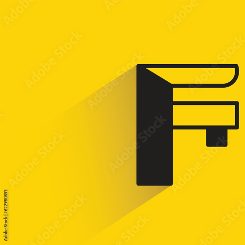 vernier caliper with shadow on yellow background