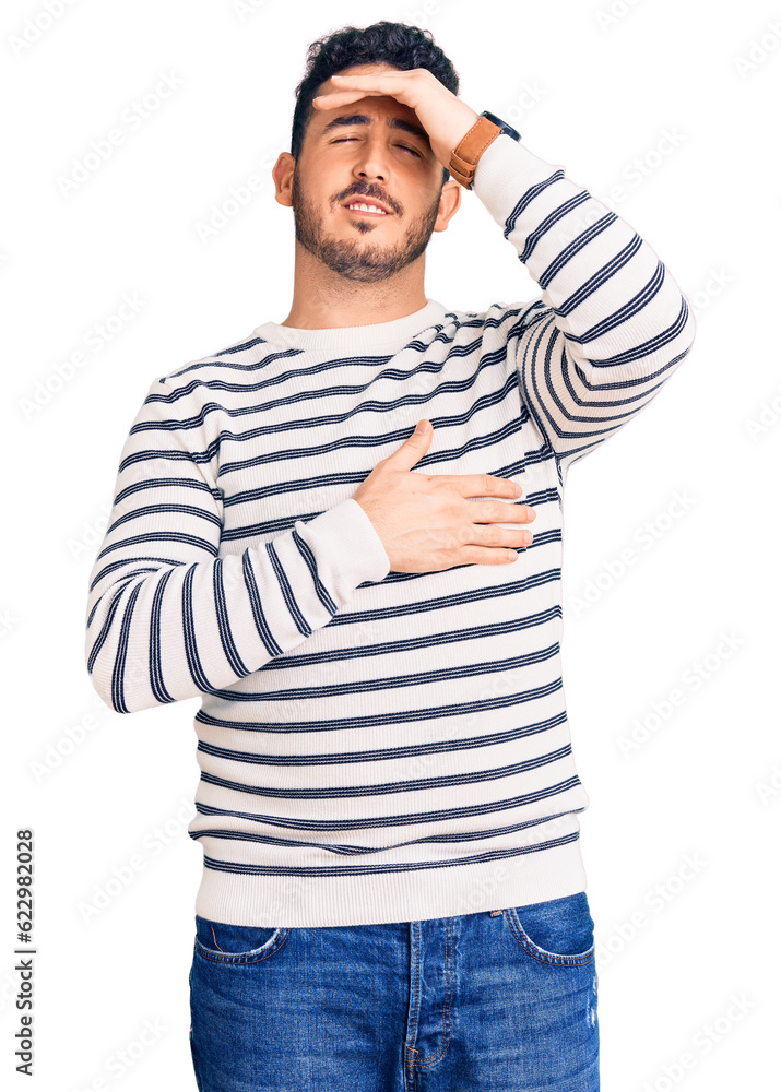 Young hispanic man wearing casual clothes touching forehead for illness and fever, flu and cold, virus sick Young hispanic man wearing casual clothes touching forehead for illness and fever, flu and cold, virus sick