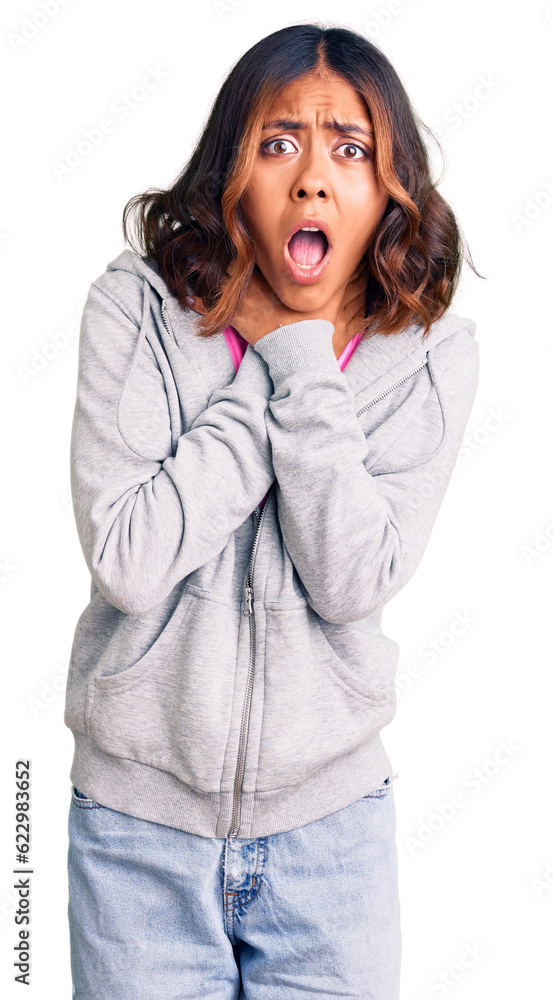 Young beautiful mixed race woman wearing casual sporty clothes shouting and suffocate because painful strangle. health problem. asphyxiate and suicide concept.