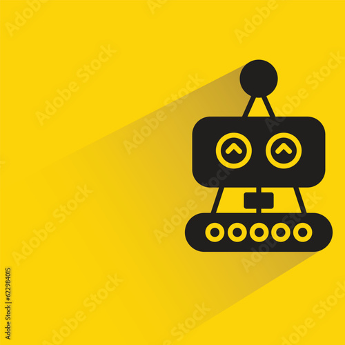 robot with shadow on yellow background
