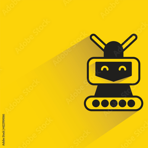 robot with shadow on yellow background