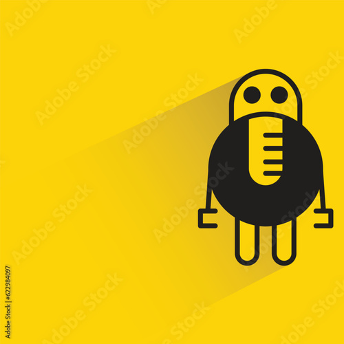 robot with shadow on yellow background