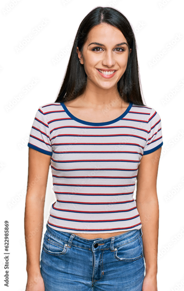Young hispanic girl wearing casual striped t shirt with a happy and cool smile on face. lucky person. Young hispanic girl wearing casual striped t shirt with a happy and cool smile on face. lucky person.