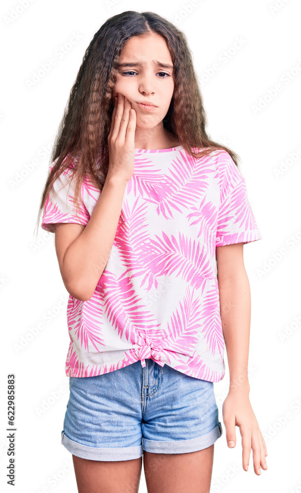 Obraz premium Cute hispanic child girl wearing casual clothes touching mouth with hand with painful expression because of toothache or dental illness on teeth. dentist