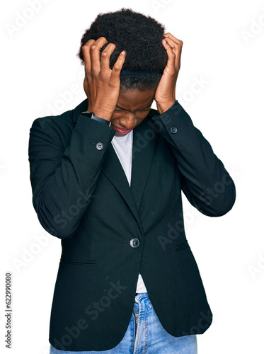 Young african american girl wearing business clothes suffering from headache desperate and stressed because pain and migraine. hands on head.