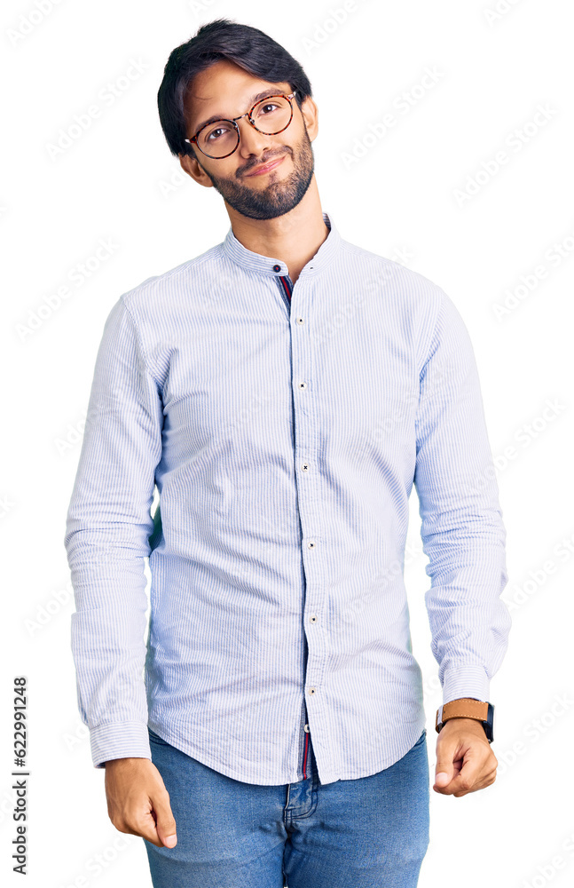 Fototapeta premium Handsome hispanic man wearing business shirt and glasses looking sleepy and tired, exhausted for fatigue and hangover, lazy eyes in the morning.