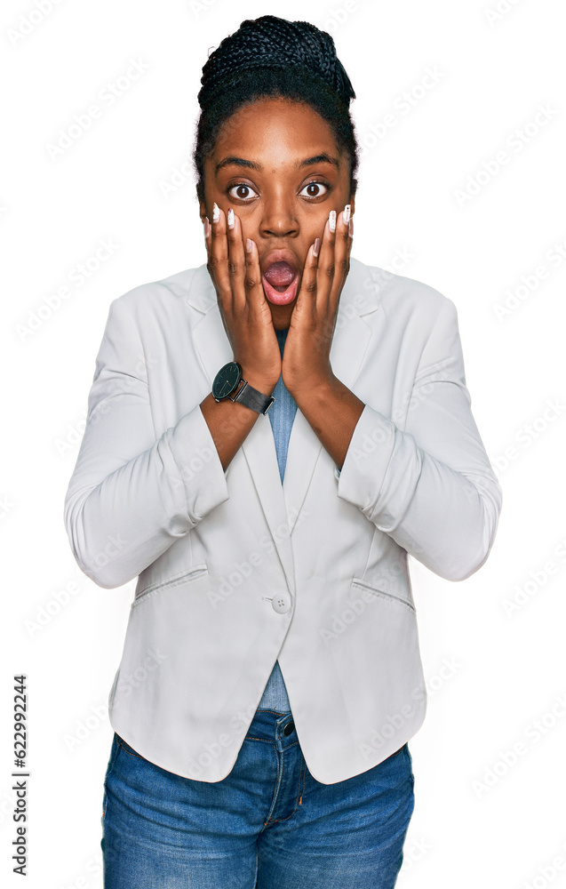 Young african american woman wearing business clothes afraid and shocked, surprise and amazed expression with hands on face Young african american woman wearing business clothes afraid and shocked, surprise and amazed expression with hands on face