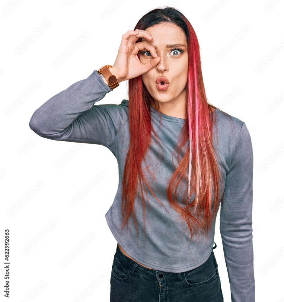 Young caucasian woman wearing casual clothes doing ok gesture shocked with surprised face, eye looking through fingers. unbelieving expression. Young caucasian woman wearing casual clothes doing ok gesture shocked with surprised face, eye looking through fingers. unbelieving expression.
