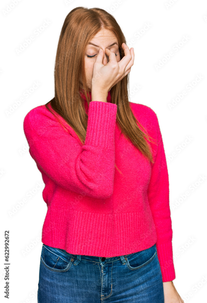 Young irish woman wearing casual clothes tired rubbing nose and eyes feeling fatigue and headache. stress and frustration concept. Young irish woman wearing casual clothes tired rubbing nose and eyes feeling fatigue and headache. stress and frustration concept.