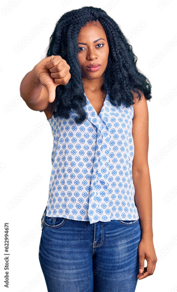 Beautiful african american woman wearing casual summer shirt looking unhappy and angry showing rejection and negative with thumbs down gesture. bad expression. Beautiful african american woman wearing casual summer shirt looking unhappy and angry showing rejection and negative with thumbs down gesture. bad expression.