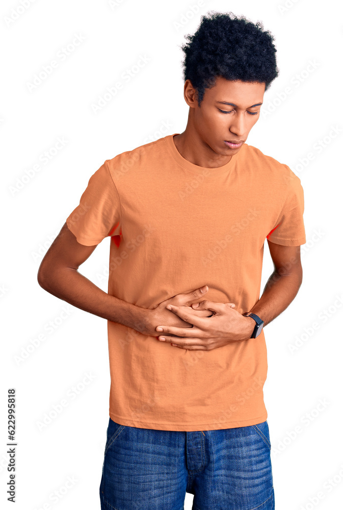 Young african american man wearing casual clothes with hand on stomach because indigestion, painful illness feeling unwell. ache concept. Young african american man wearing casual clothes with hand on stomach because indigestion, painful illness feeling unwell. ache concept.