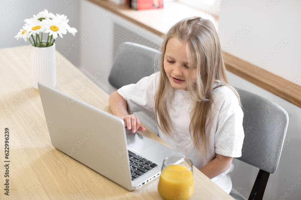 girl having video call in remote class with teacher using laptop, kid greeting with tutor, learning online on computer, home learning concept. Programming