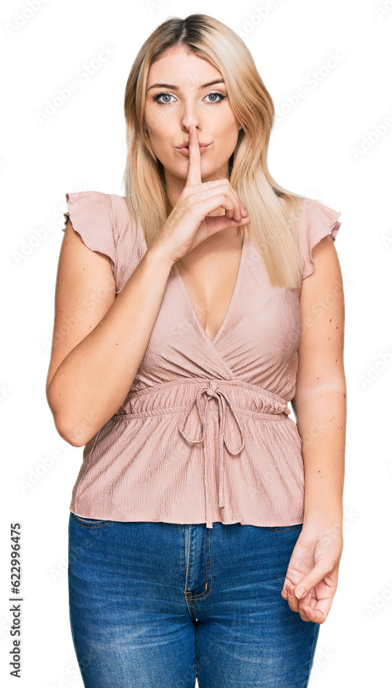 Young caucasian woman wearing casual clothes asking to be quiet with finger on lips. silence and secret concept. Young caucasian woman wearing casual clothes asking to be quiet with finger on lips. silence and secret concept.