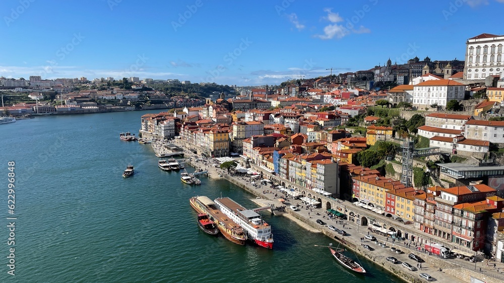 Porto, Portugal old town ribeira aerial promenade view with colorful houses, Douro river and boats