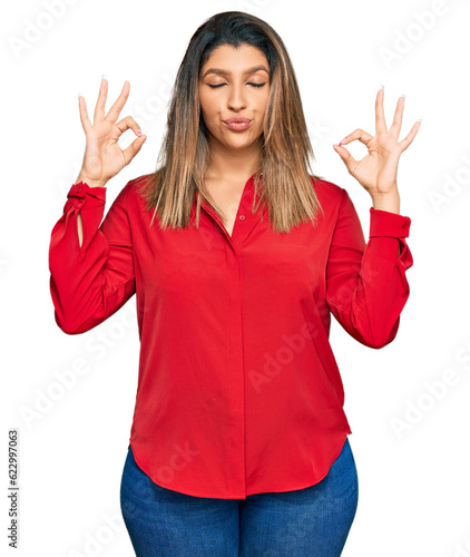 Beautiful brunette woman wearing casual clothes relax and smiling with eyes closed doing meditation gesture with fingers. yoga concept.
