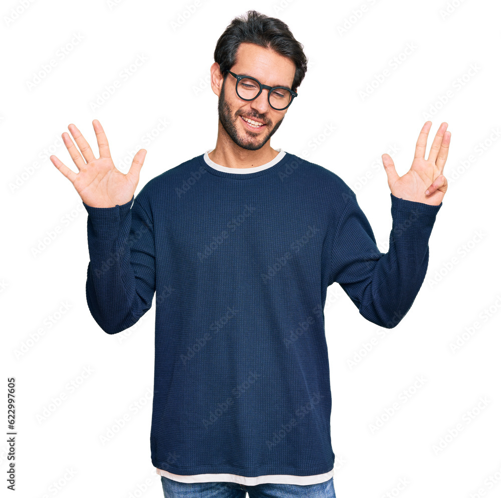 Young hispanic man wearing casual clothes and glasses showing and pointing up with fingers number nine while smiling confident and happy. Young hispanic man wearing casual clothes and glasses showing and pointing up with fingers number nine while smiling confident and happy.