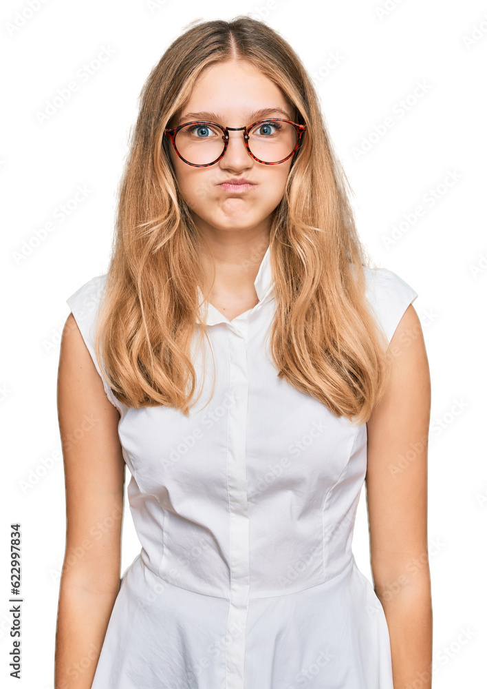 Beautiful young caucasian girl wearing casual clothes and glasses puffing cheeks with funny face. mouth inflated with air, crazy expression. Beautiful young caucasian girl wearing casual clothes and glasses puffing cheeks with funny face. mouth inflated with air, crazy expression.