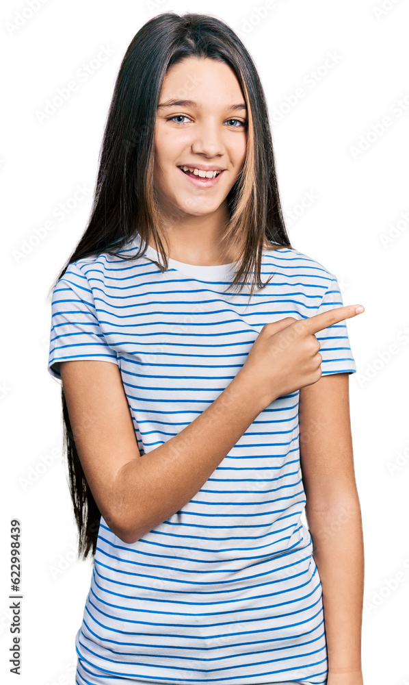 Young brunette girl with long hair pointing with fingers to the side celebrating crazy and amazed for success with open eyes screaming excited. Young brunette girl with long hair pointing with fingers to the side celebrating crazy and amazed for success with open eyes screaming excited.