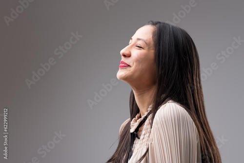 Fotografia Woman suppresses joy, anticipating bright future