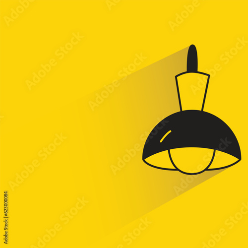 ceiling lamp with shadow on yellow background