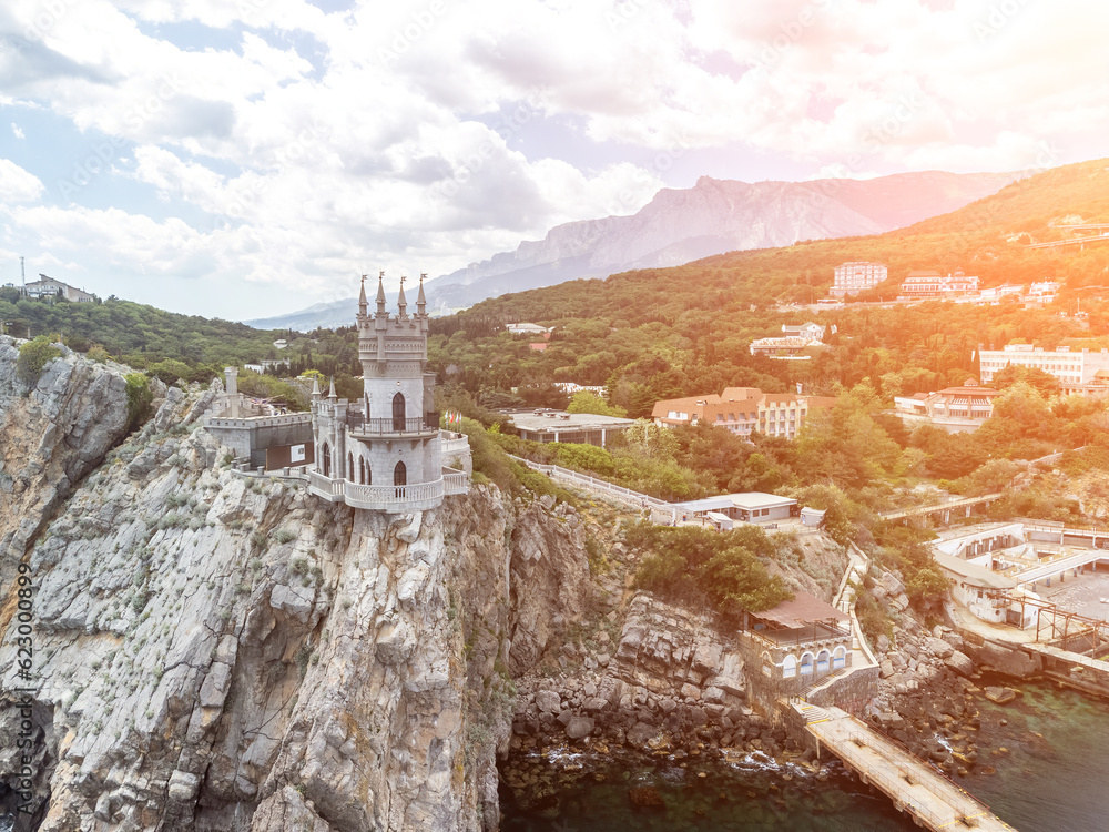 Crimea Swallow's Nest Castle on the rock over the Black Sea. It is a tourist attraction of Crimea. Amazing aerial view of the Crimea coast with the castle above abyss on sunny day.