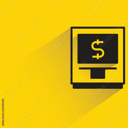 atm with shadow on yellow background