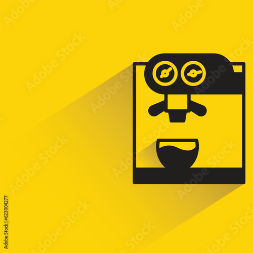 coffee machine with shadow on yellow background