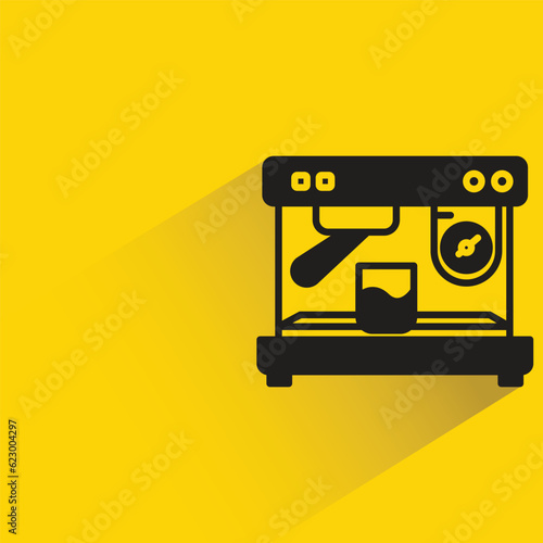 coffee machine with shadow on yellow background