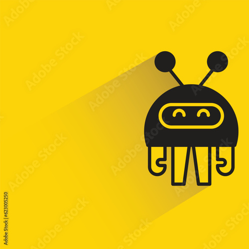 cute robot with shadow on yellow background