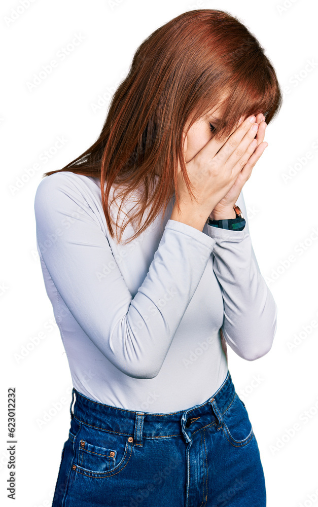 Redhead young woman wearing casual turtleneck sweater with sad expression covering face with hands while crying. depression concept. Redhead young woman wearing casual turtleneck sweater with sad expression covering face with hands while crying. depression concept.