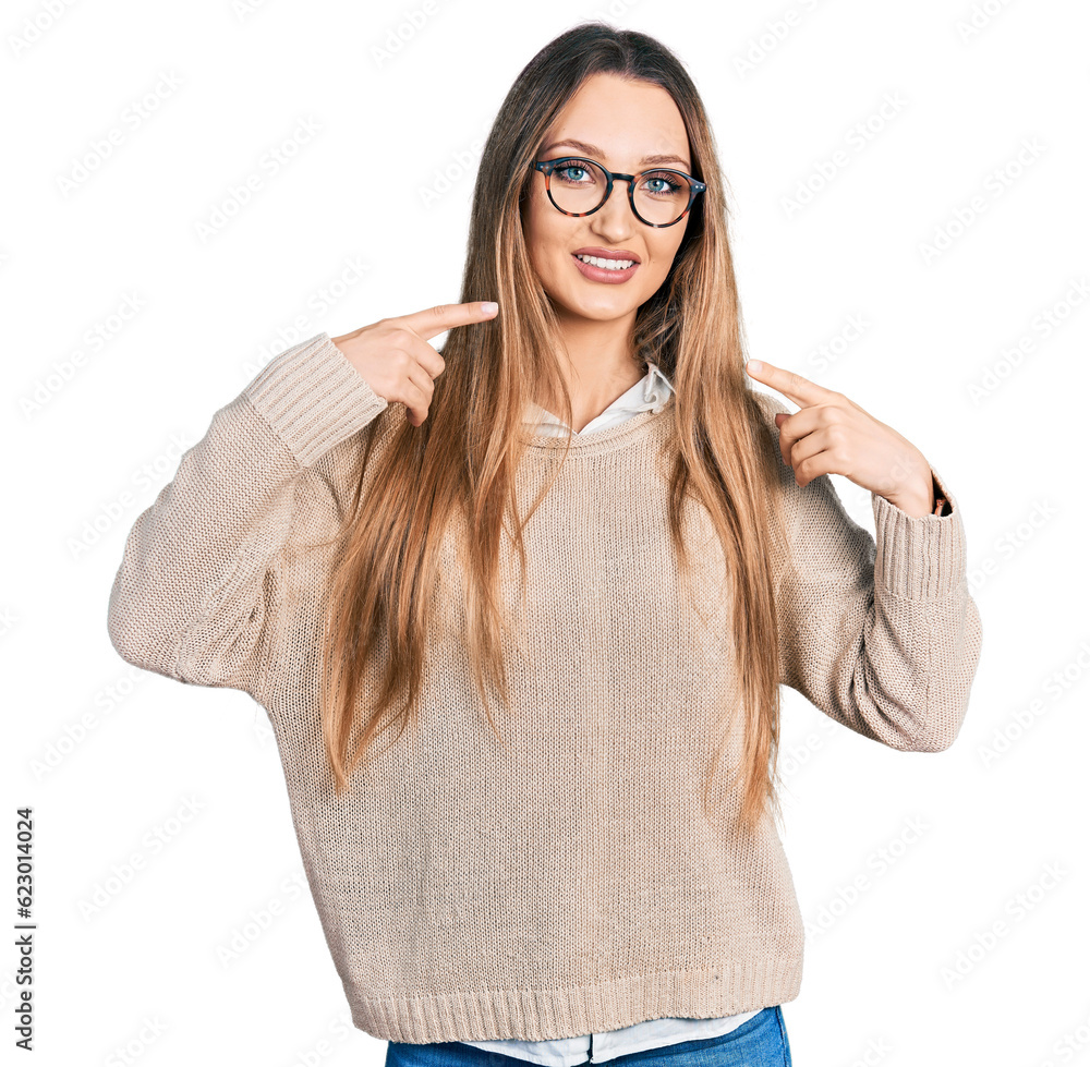 Beautiful caucasian woman wearing casual sweater and glasses smiling cheerful showing and pointing with fingers teeth and mouth. dental health concept. Beautiful caucasian woman wearing casual sweater and glasses smiling cheerful showing and pointing with fingers teeth and mouth. dental health concept.