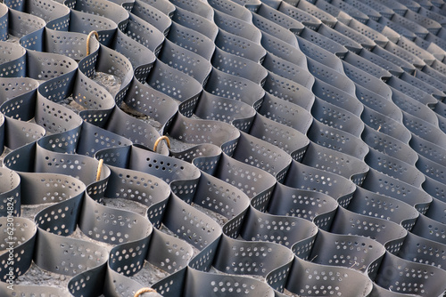 Polymer geogrid mesh cells background